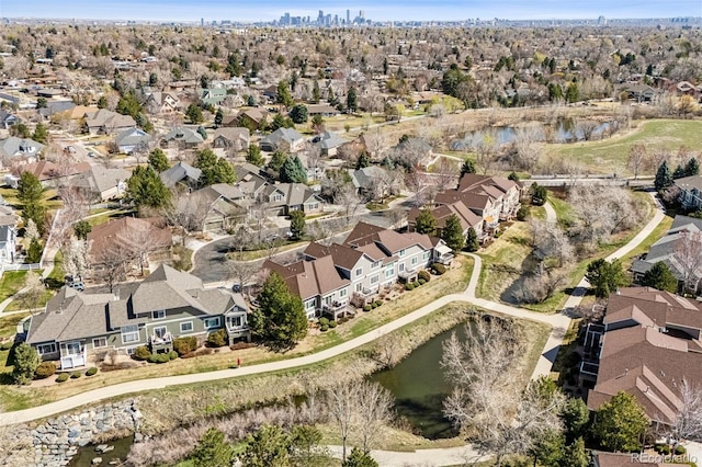 view of property location with a nearby body of water and nearby suburban area