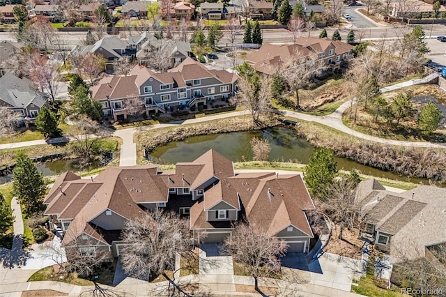 aerial perspective of suburban area featuring a nearby body of water
