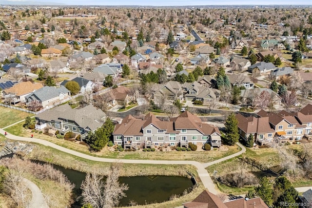 view of property location with a nearby body of water and nearby suburban area