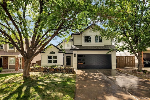 9371 Princeton Ln, Highlands Ranch, CO 80130 - traditional-style house with concrete driveway, a garage, brick siding, and roof with shingles