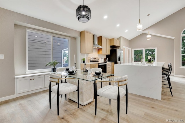 9371 Princeton Ln, Highlands Ranch, CO 80130 - dining area featuring light wood-type flooring, recessed lighting, and high vaulted ceiling