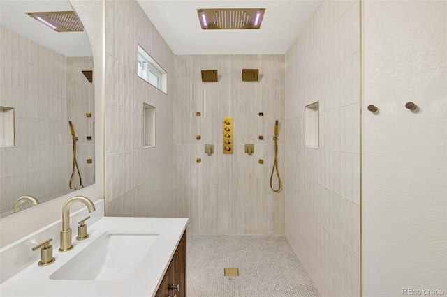 9371 Princeton Ln, Highlands Ranch, CO 80130 - full bathroom with tiled shower, vanity, tile walls, and tile patterned floors
