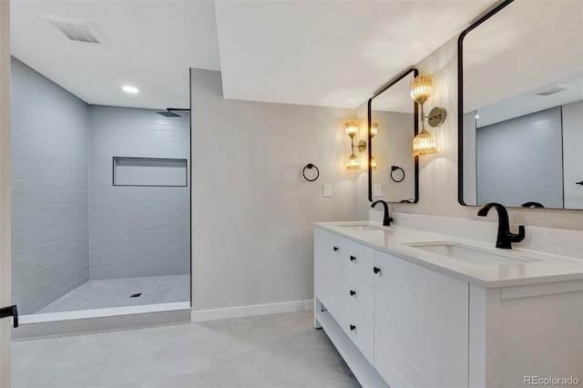 9371 Princeton Ln, Highlands Ranch, CO 80130 - full bathroom featuring double vanity, a tile shower, and tile patterned floors