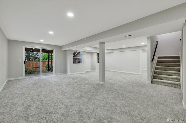 9371 Princeton Ln, Highlands Ranch, CO 80130 - below grade area featuring light carpet, stairs, and recessed lighting