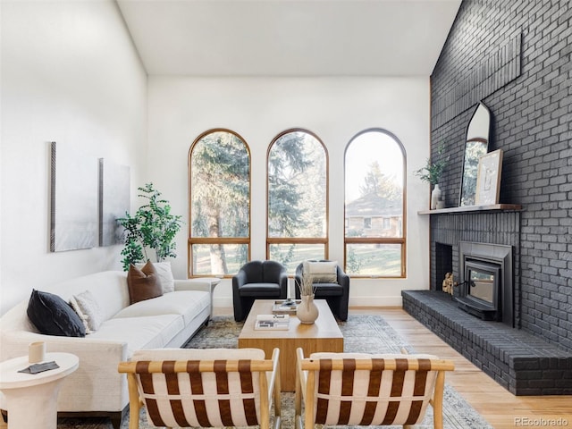 living room with baseboards and wood finished floors