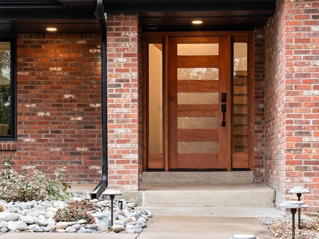 property entrance with brick siding