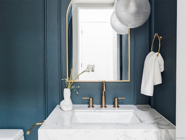 bathroom with vanity and toilet