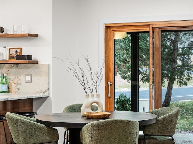 dining area featuring a wealth of natural light