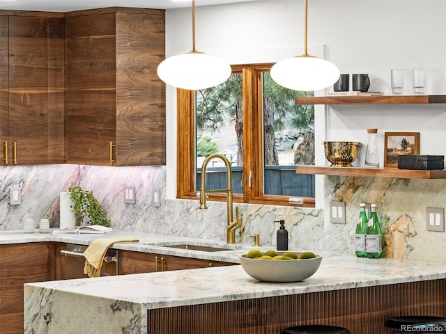 kitchen with open shelves, light stone counters, backsplash, and a sink