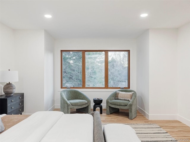 bedroom with recessed lighting, baseboards, and light wood finished floors