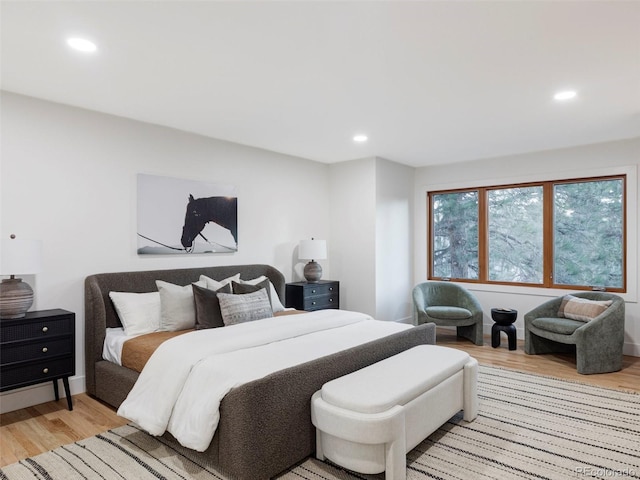 bedroom featuring light wood-style flooring and recessed lighting