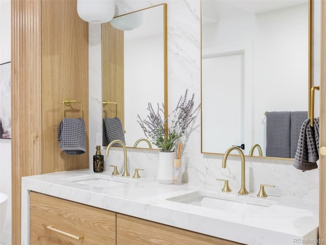 full bath featuring a sink and double vanity