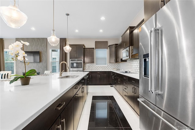 11193 Mission Walk St, Parker, CO 80134 - kitchen featuring appliances with stainless steel finishes, light countertops, dark brown cabinetry, and recessed lighting