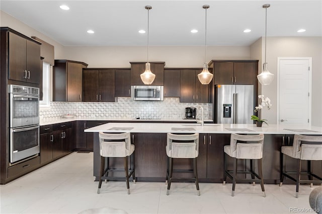 11193 Mission Walk St, Parker, CO 80134 - kitchen with stainless steel appliances, dark brown cabinets, backsplash, and recessed lighting