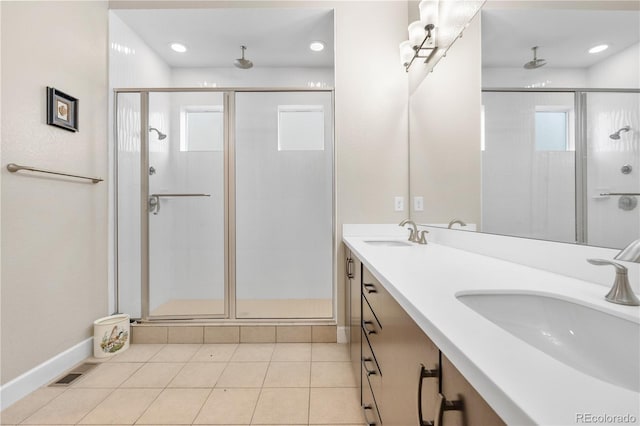 11193 Mission Walk St, Parker, CO 80134 - full bath featuring a stall shower, double vanity, tile patterned flooring, and recessed lighting