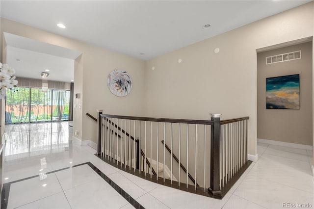 11193 Mission Walk St, Parker, CO 80134 - hall with an upstairs landing, tile patterned floors, and recessed lighting