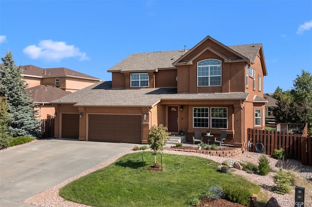 12166 Sunset Crater Dr, Peyton, CO 80831 - traditional-style house with an attached garage, stucco siding, driveway, and a shingled roof