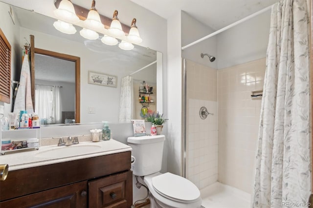 bathroom featuring a shower with curtain, vanity, and toilet