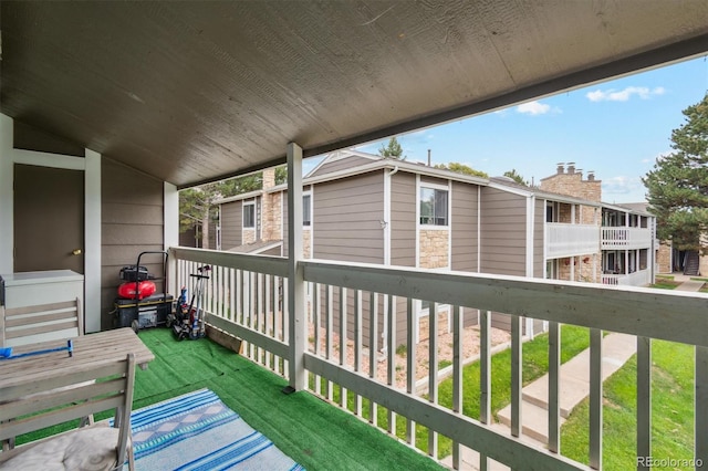 wooden terrace with a yard