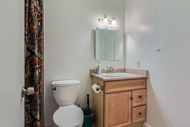 full bath with vanity and toilet