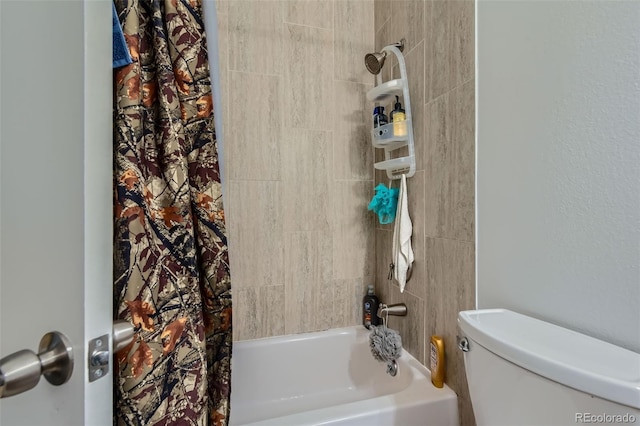 bathroom featuring toilet and shower / tub combo with curtain