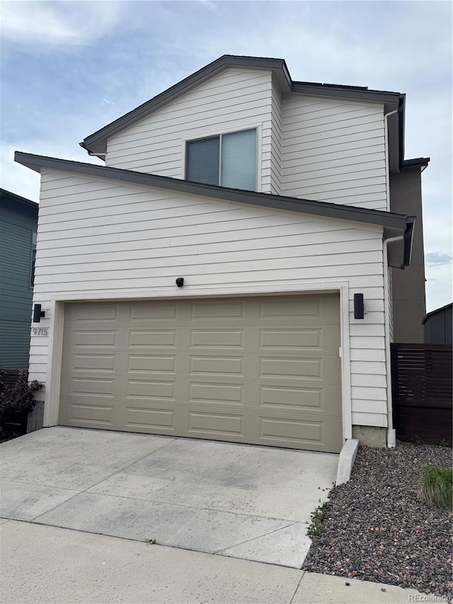 9715 Taylor River Cir, Littleton, CO 80125 - garage featuring driveway