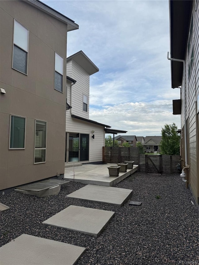 9715 Taylor River Cir, Littleton, CO 80125 - fenced backyard featuring a patio area