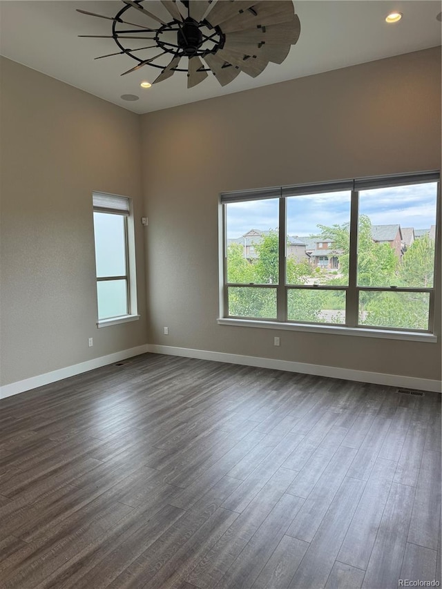9715 Taylor River Cir, Littleton, CO 80125 - spare room featuring dark wood finished floors and recessed lighting