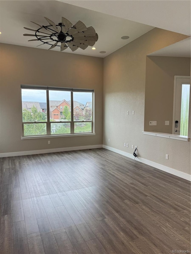 9715 Taylor River Cir, Littleton, CO 80125 - unfurnished room with healthy amount of natural light, dark wood finished floors, and recessed lighting