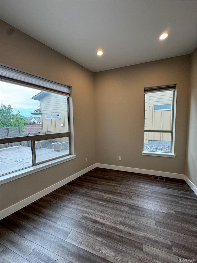 9715 Taylor River Cir, Littleton, CO 80125 - unfurnished room with plenty of natural light, dark wood-type flooring, and recessed lighting