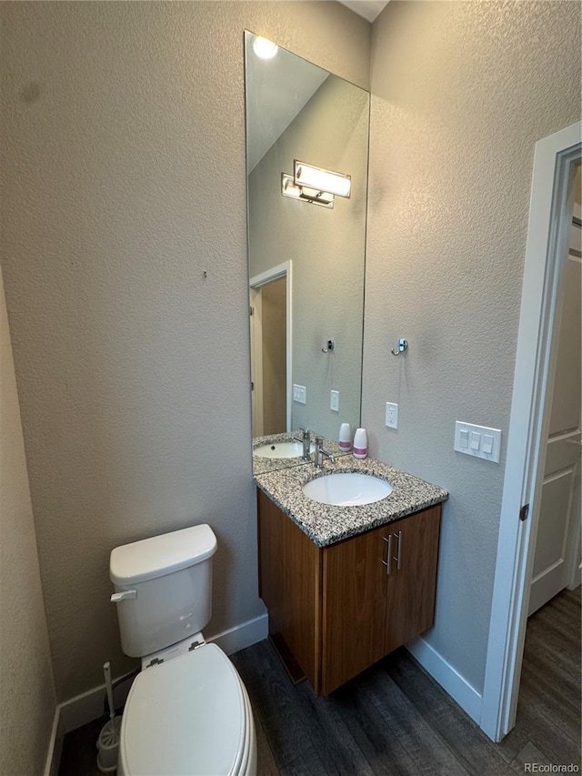9715 Taylor River Cir, Littleton, CO 80125 - bathroom featuring wood finished floors, double vanity, and a textured wall