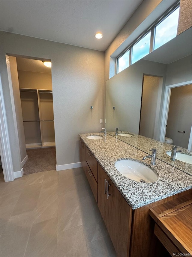 9715 Taylor River Cir, Littleton, CO 80125 - full bath featuring double vanity and a spacious closet