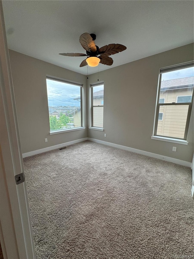 9715 Taylor River Cir, Littleton, CO 80125 - carpeted spare room with baseboards and a ceiling fan