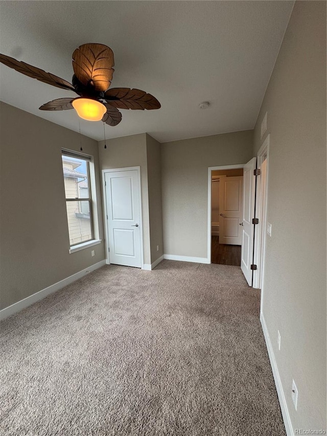 9715 Taylor River Cir, Littleton, CO 80125 - unfurnished bedroom featuring carpet floors and a ceiling fan