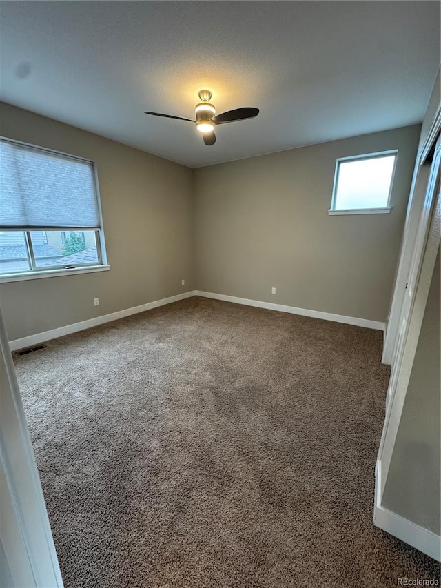 9715 Taylor River Cir, Littleton, CO 80125 - unfurnished room featuring plenty of natural light, carpet flooring, and ceiling fan