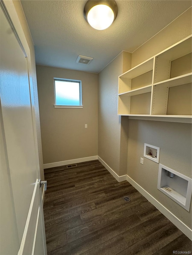 9715 Taylor River Cir, Littleton, CO 80125 - laundry area with washer hookup, dark wood finished floors, and a textured ceiling