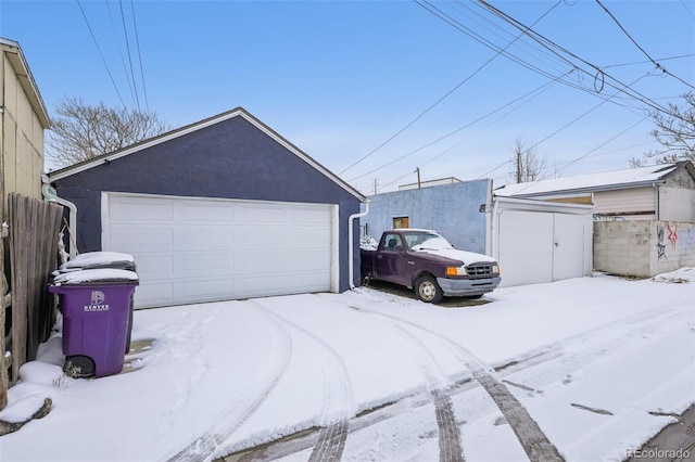 view of snow covered garage