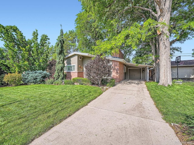 2609 S Dahlia St, Denver, CO 80222 - mid-century inspired home featuring brick siding, a front yard, a garage, and driveway