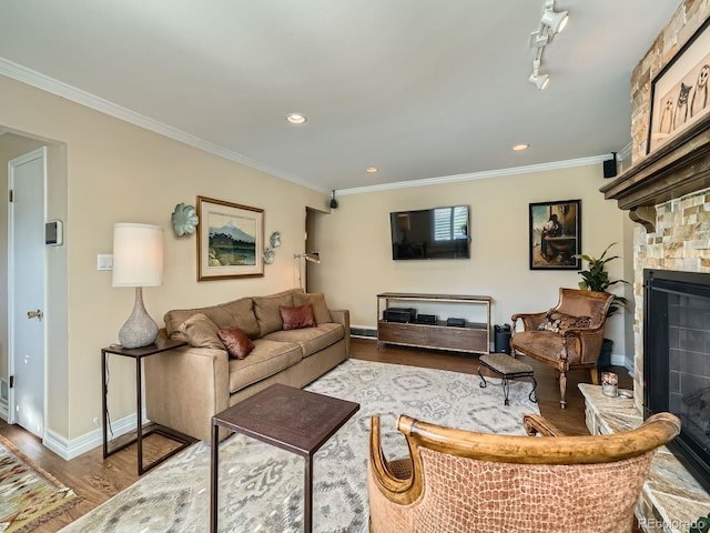 2609 S Dahlia St, Denver, CO 80222 - living room featuring a fireplace, wood finished floors, ornamental molding, baseboards, and recessed lighting