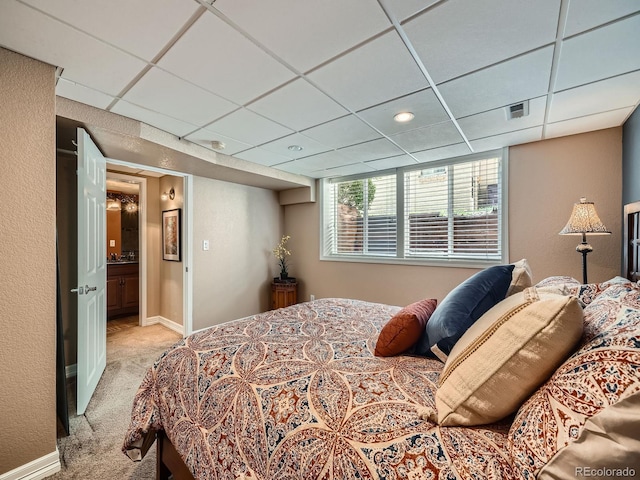 2609 S Dahlia St, Denver, CO 80222 - bedroom featuring light colored carpet, a drop ceiling, and baseboards