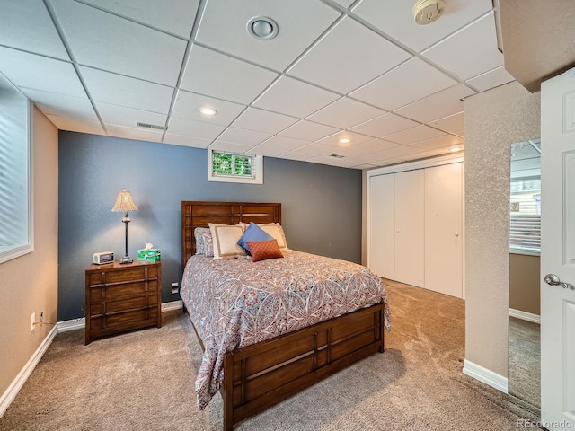 2609 S Dahlia St, Denver, CO 80222 - bedroom featuring carpet floors, a closet, a paneled ceiling, baseboards, and recessed lighting