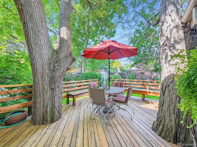 2609 S Dahlia St, Denver, CO 80222 - wooden deck featuring outdoor dining space and a fenced backyard