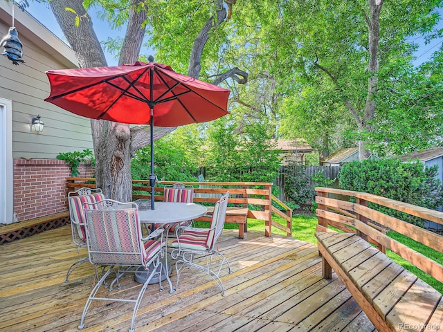 2609 S Dahlia St, Denver, CO 80222 - wooden terrace with outdoor dining area and a fenced backyard