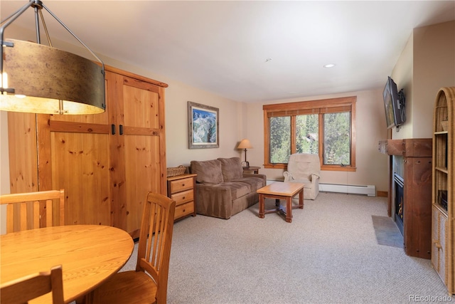 53 Hunki Dori Ct Unit 8886, Keystone, CO 80435 - living area featuring light carpet, a fireplace with flush hearth, a baseboard heating unit, and recessed lighting