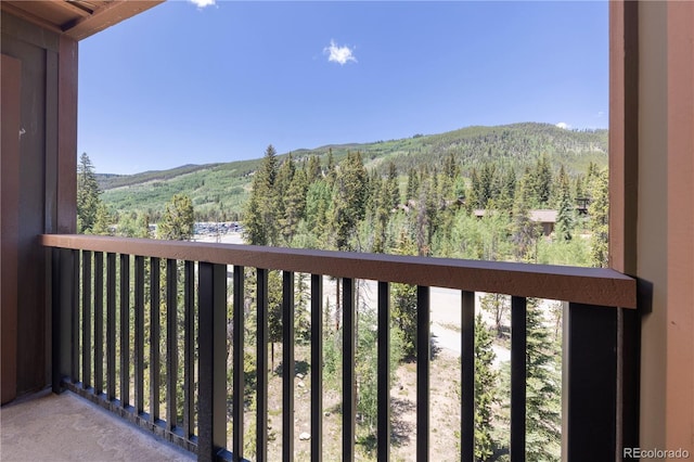 53 Hunki Dori Ct Unit 8886, Keystone, CO 80435 - balcony featuring a wooded view and a mountain view