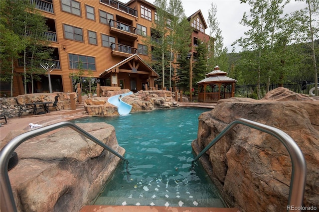 53 Hunki Dori Ct Unit 8886, Keystone, CO 80435 - outdoor pool featuring a gazebo, a water slide, and a patio