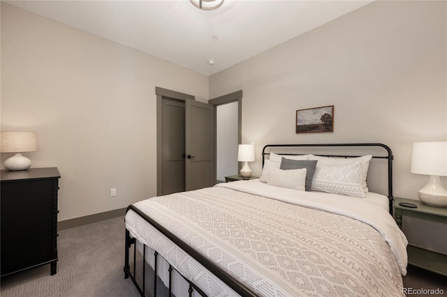 bedroom with carpet floors and baseboards