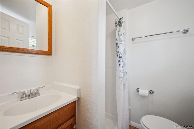 5549 S Greenwood St, Littleton, CO 80120 - bathroom with toilet, vanity, and shower / bath combo with shower curtain