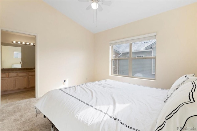 18661 E Water Dr Unit F, Aurora, CO 80013 - bedroom featuring connected bathroom, light tile patterned floors, light carpet, and ceiling fan