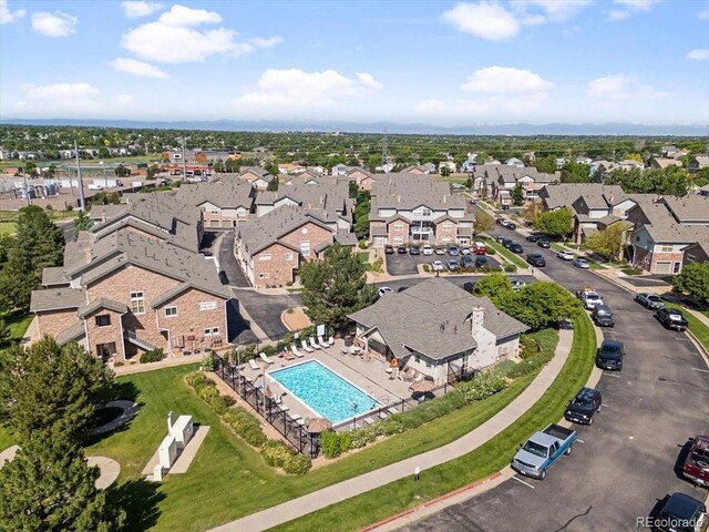 18661 E Water Dr Unit F, Aurora, CO 80013 - aerial overview of property's location with a pool area and nearby suburban area